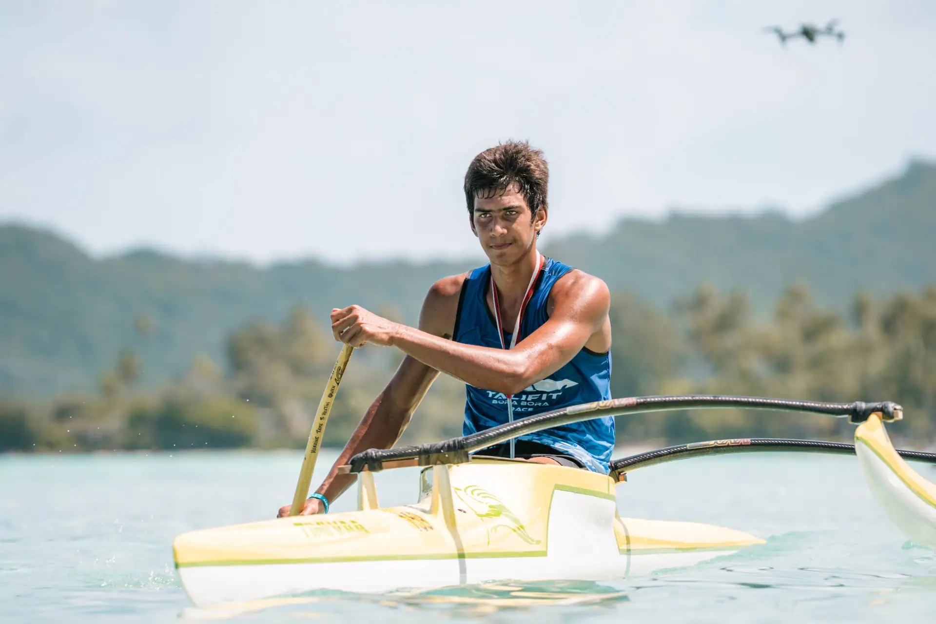 Va'a paddlers at sunset